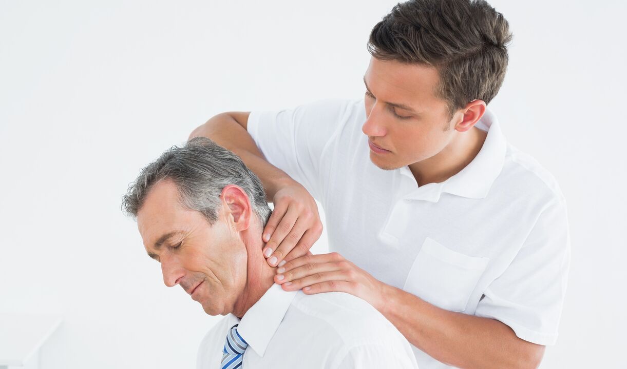 doctor examines his neck with osteochondrosis